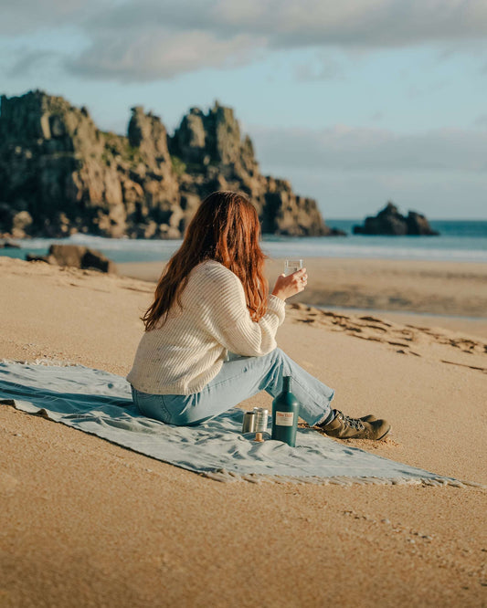 Ebba Tidal Gin on the Cornish coast at Porthcurno