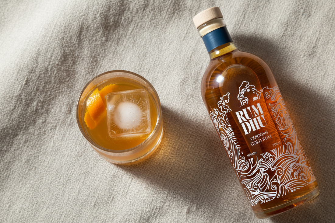 Rum Dhu Gold Rum bottle with Old Fashioned ingredients on linen