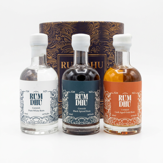 Rum Dhu bottles and gift box on white